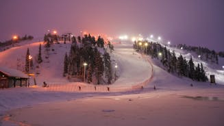 photo of beautiful view of Finnish landscape with trees in snow, ruka, karelia, lapland, hilly winter landscapes in famous winter sports area called Ruka.