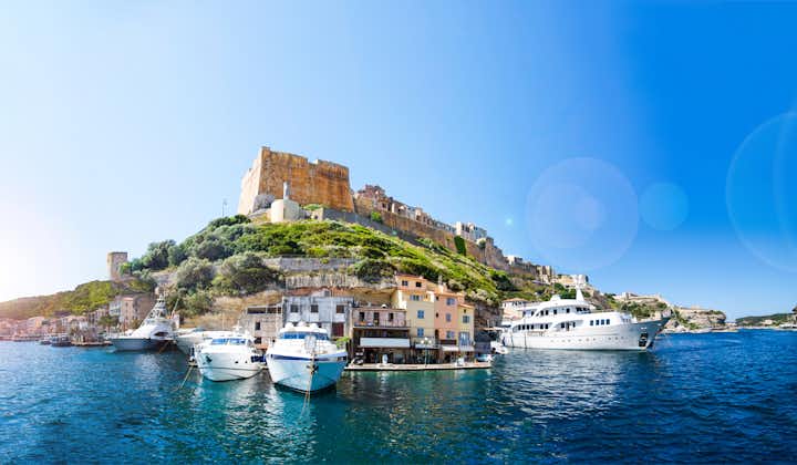 Panoramic view of the Bonifacio port, city, castle and yachts on a sunny summer day.