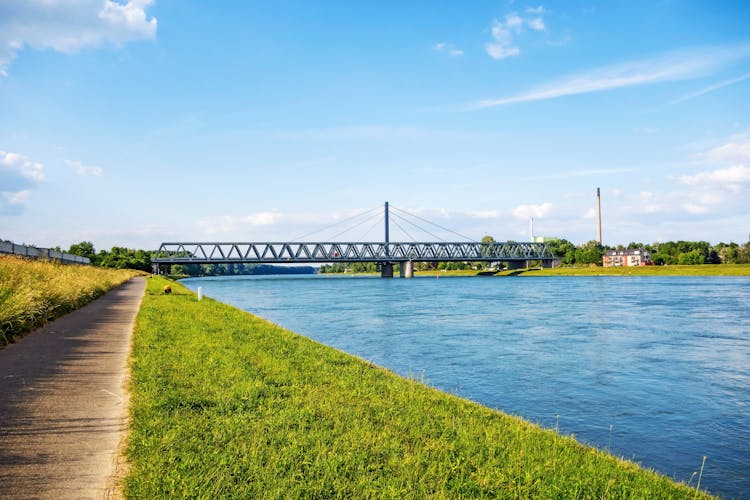 Photo of Rhine bridge in Karlsruhe, view from river rhine bikeway riversides.