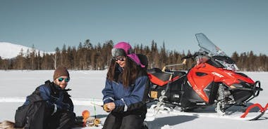 Lappish Lunch Break -Snowmobiling, ice fishing and tasty food