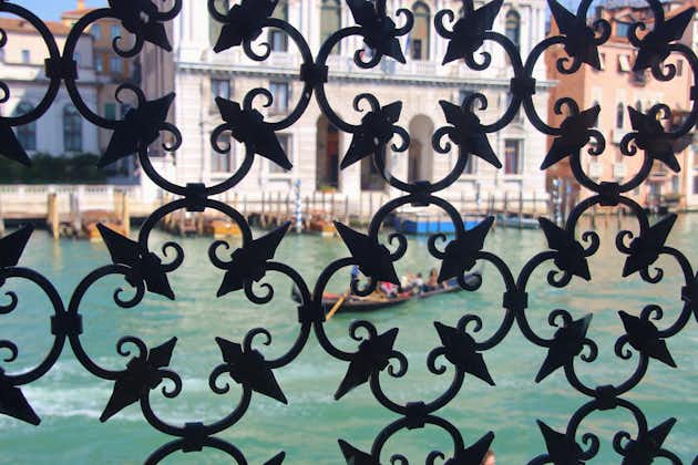 photo ofThe Grand Canal in Venice, seen through a window with wrought iron grill in the Peggy Guggenheim Collection. Venice, Italy,