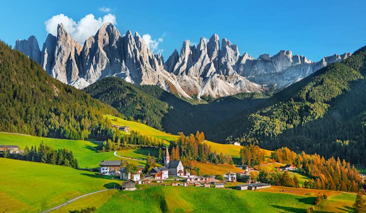 Famous alpine place Santa Maddalena village with magical Dolomites mountains in background, Val di Funes valley, Trentino Alto Adige region, Italy.