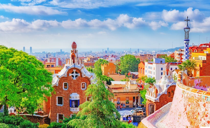 Photo of fantastic view on Barcelona city over Park Guell, famous and popular landmark and travel destination in Europe.