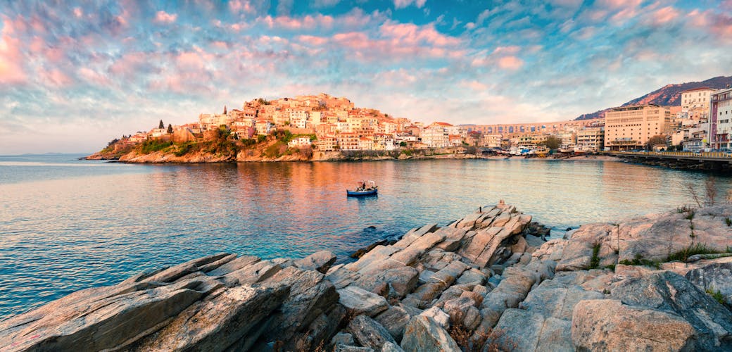 Photo of sunny spring panorama of Aegean Sea. Colorful sunrise in Kavala city.