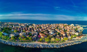 Photo of panoramic aerial view over small ancient resort town of Pomorie with old European small houses , Bulgaria.