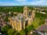 Photo of aerial view of Durham Cathedral that is a cathedral in the historic city center of Durham, England, UK.