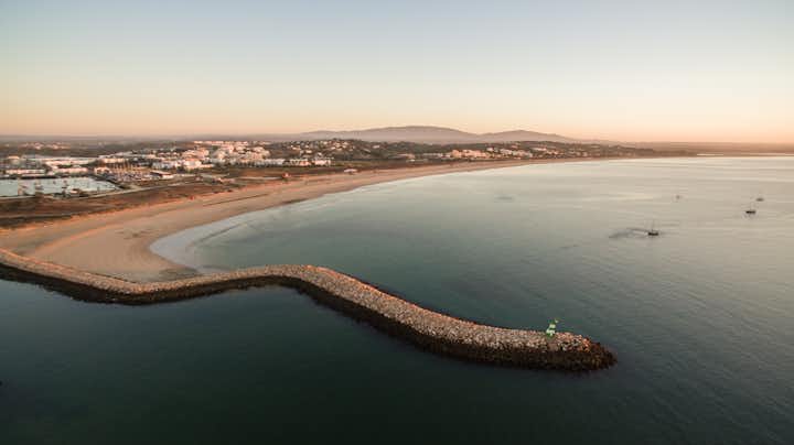 Aerial view of beautiful Meia Praia beach in Lagos, Algarve, Portugal at morning.
