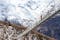 photo of girl in pigtails walks across the longest suspension bridge in the world - Charles Kuonen Suspension Bridge; walk across the fearsome bridge overlooking the mighty snowy alpine peaks, Switzerland.