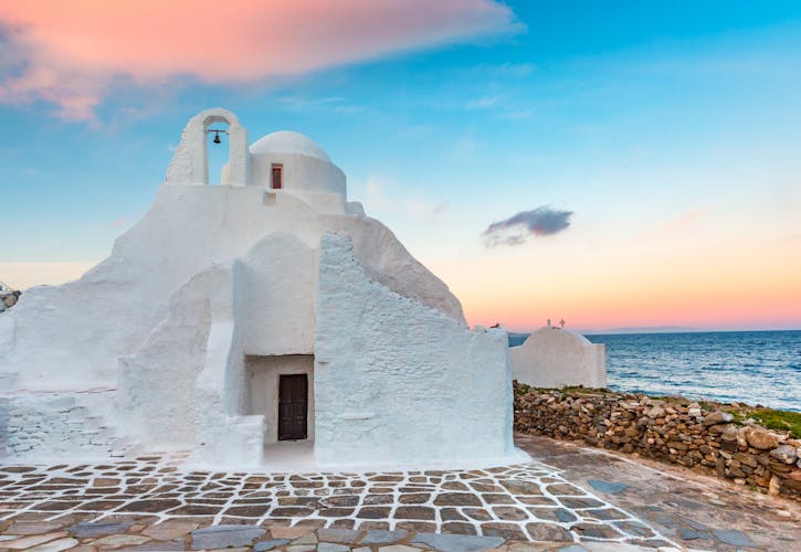 Photo of church of Panagia Paraportiani at sunrise, the most famous architectural structures in Greece, on the island Mykonos, The island of the winds, Greece.