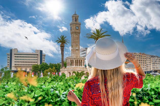 photo of tourist girl watches Konak Square with old clock tower, Izmir, Turkey.