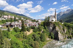 Photo of  beautiful Scuol town in Swiss Alps and Inn river, Switzerland.