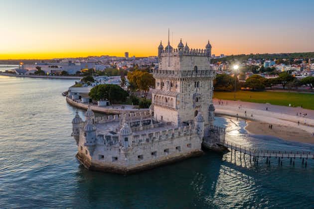 Photo of aerial view of the Belem tower at beautiful sunset at the bank of Tejo River in Lisbon ,Portugal.