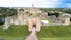 Photo of aerial view of Warkworth Castle, a ruined medieval building in the village of the same name, United Kingdom.
