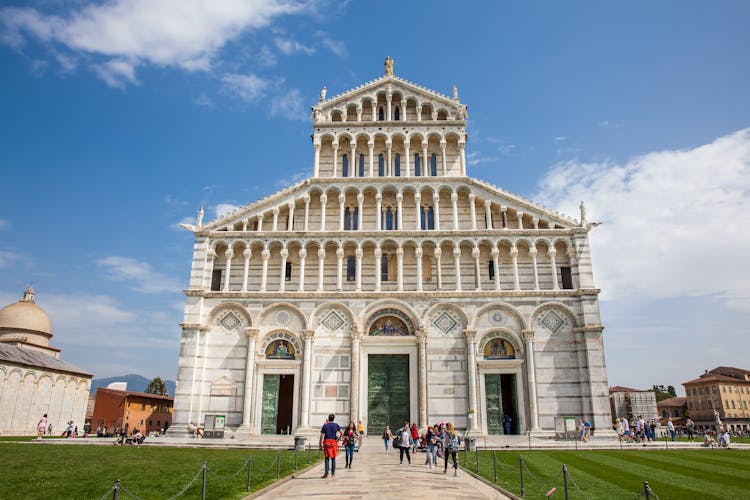 Photo of Tourists at the Primatial Metropolitan Cathedral of the Assumption of Mary in Pisa.