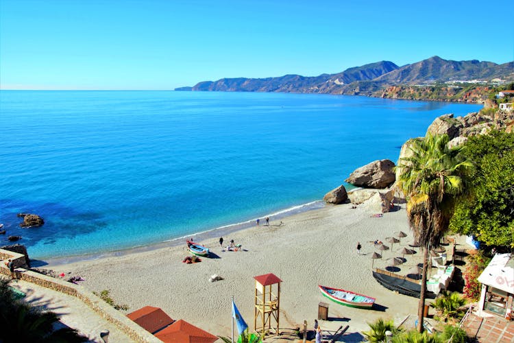 Photo of tourist spaces in the town of Nerja, Málaga, one of the white villages of Andalusia, Spain, Calahonda beautiful beach.