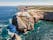 Photo of aerial view of beautiful lighthouse located on high cliffs of Saint Vincent cape in Sagres, Algarve, Portugal.