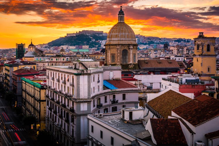 Photo of Stunning rooftop view of Naples from above during sunset.