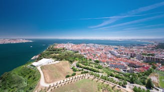 Photo of aerial view of Costa da Caparica coastline of glorious sandy beaches, powerful Atlantic waves, Portugal.
