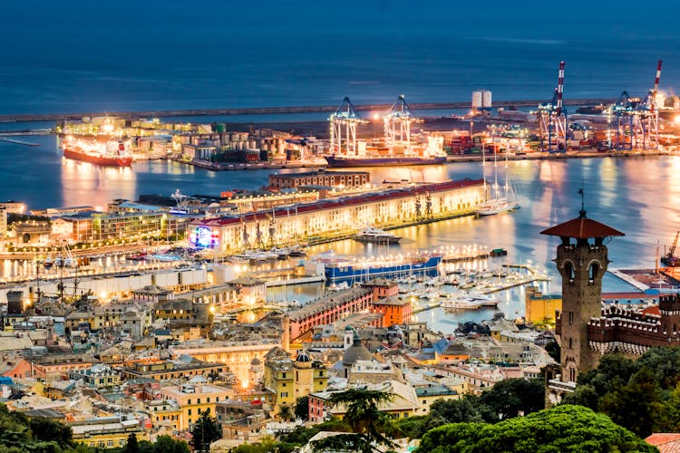 Photo of Genoa port from above at night.