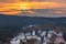Photo of view to Karlovy Vary from Three Crosses Lookout at sunset, Czechia.