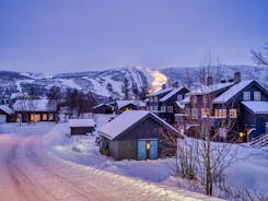 photo of panorama of ski resort with ski slopes and approaching snowstorm in Geilo, Norway.