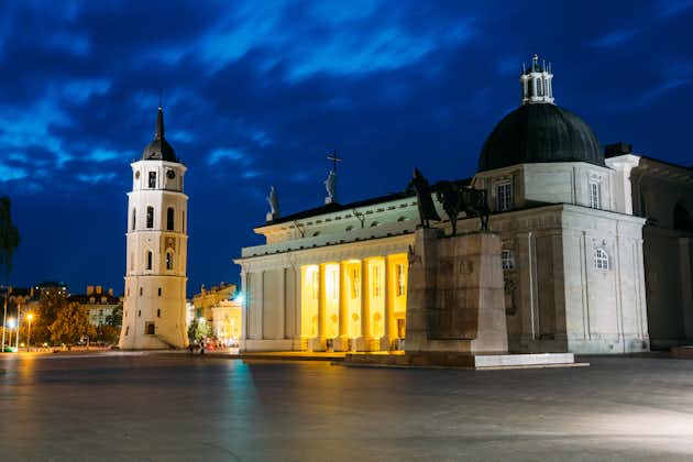 photo of vilnius, Lithuania. night or evening view of cathedral basilica of st. stanislaus and st. vladislav with the bell tower, Blue cloudy sky background. Catholic cathedral at the cathedral square.