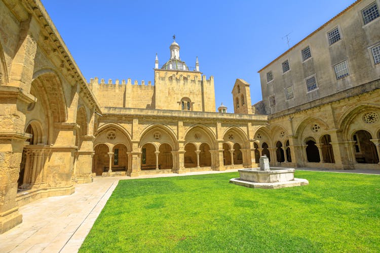 Gothic romanesque cloister of old Coimbra Cathedral and dome. Se Velha de Coimbra, is one of most important romanesque buildings in Portugal and landmark in Coimbra, north of Portugal.