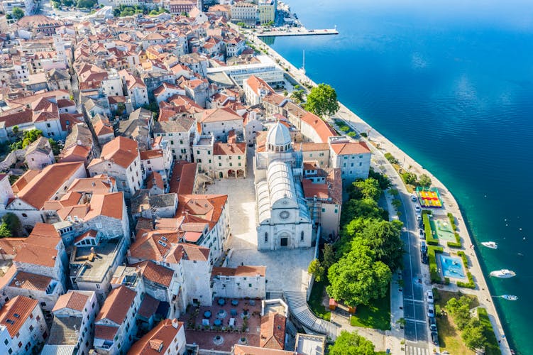 Photo of aerial view of the city of Sibenik with beach view in the summer morning, Croatia.