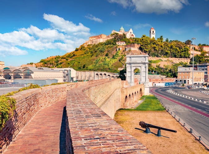 Photo of Wonderful view of Arch of Trajan and Cattedrale di San Ciriaco church on background. Sunny summer cityscape of Ancona town, Italy, Europe. Traveling concept background.