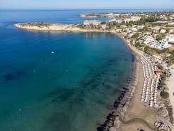 Photo of aerial view on clear blue water of Coral bay in Peyia, Cyprus.