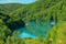 Kozjak lake with ferry boats overlook on Plitvice Lakes National Park of Croatia. Natural forest park with lakes and waterfalls in Lika region. UNESCO World Heritage of Croatia named Plitvicka Jezera