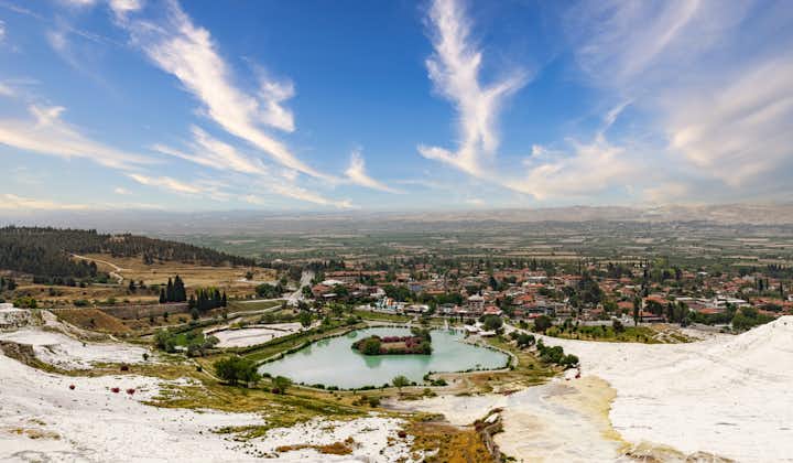 Photo of Travertine terraces near geothermal springs. lake with blue water in Denizli Province..
