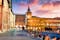photo of Colorful spring sunset on the main square of City of Bologna with Palazzo d'Accursio and facade of Basilica di San Petronio. Great cityscape of Bologna, Italy, Europe. Traveling concept background.