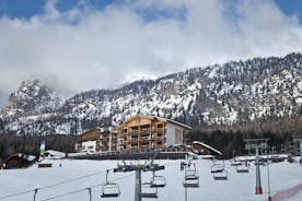 photo of Ski Resort of Corvara on a sunny day, Alta Badia, Dolomites Alps, Italy.