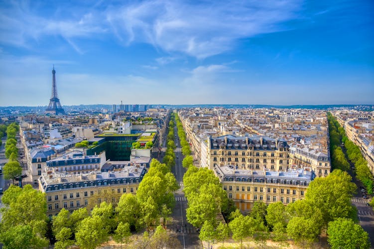 An  overview of the Eiffel Tower and Paris, France from the Arc de Triomphe.