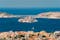 photo of Marseille town and Chateau d'If castle famous historical fortress and prison on island in Marseille Bay with yacht in sea. Marseille, France.