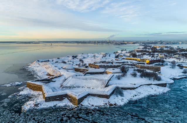 Photo of aerial winter view of Helsinki fortress Suomenlinna at the coast of Baltic sea in Helsinki, Finland.
