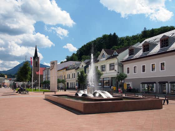 Photo of View of Hviezdoslav Square, pedestrian zone in Dolny Kubin town during sunny day in summer. 