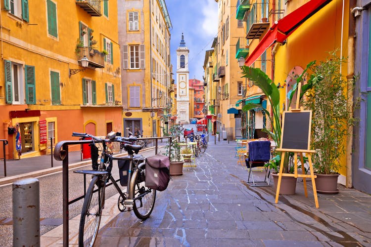 Photo of Nice colorful street architecture and church view, tourist destination of French riviera.