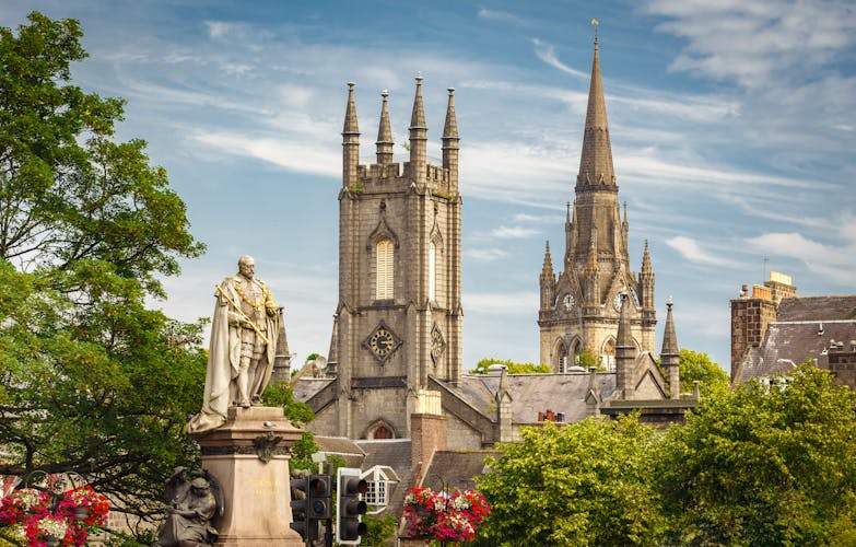 Photo of Statue of Edward VII with Former South Church with Kirk of St Nicholas (Triple Kirk) in the background, in Aberdeen, Scotland, UK.