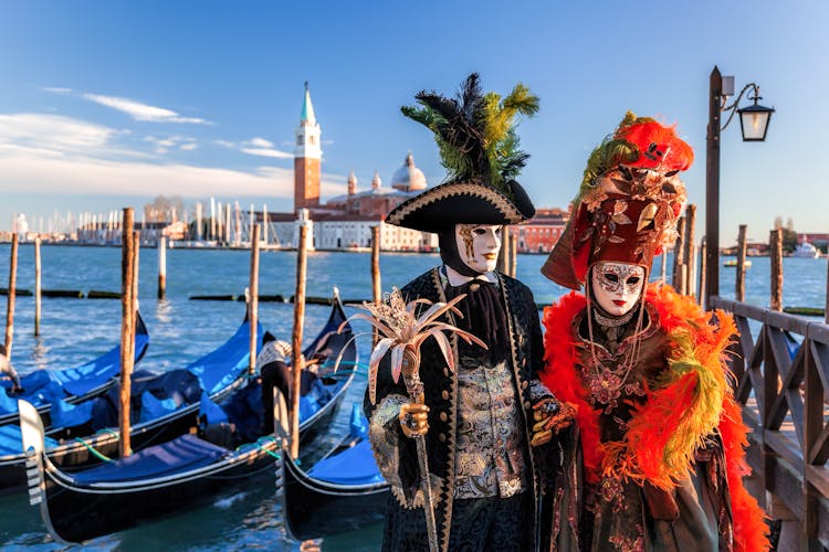 Colorful carnival masks at a traditional festival in Venice, Italy.
