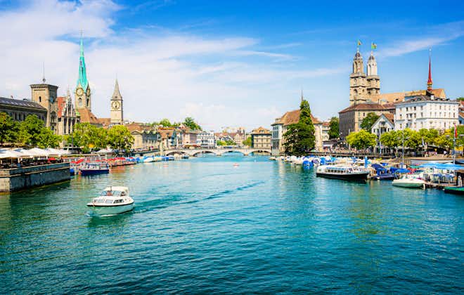 Photo of Scenic panoramic view of historic Zürich city center with famous Fraumünster and Grossmünster Church and river Limmat at Lake Zurich on a beautiful sunny day with blue sky in summer, Switzerland.