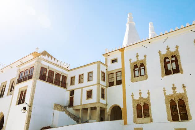 Photo of Manueline wing with two white famous chimneys of National Palace of Sintra or Town Palace, Portugal.