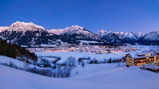 photo of aerial panoramic view of Oberstorf in Winter with snow in Bavaria, Germany.