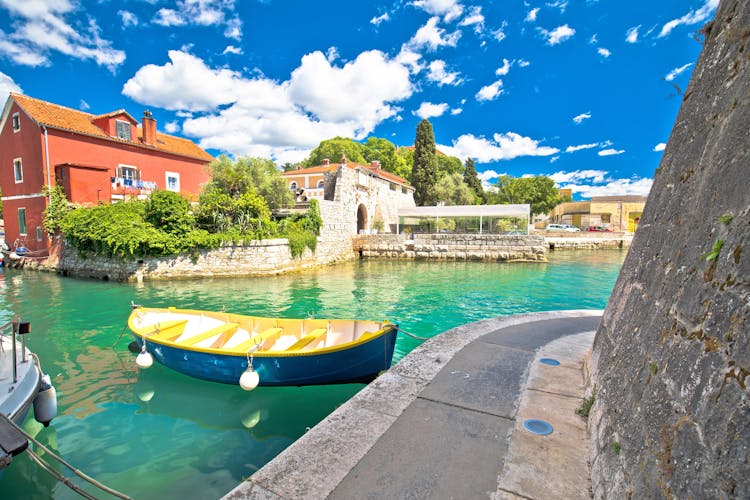 Photo of Zadar. Historic Fosa harbor bay in Zadar boats and architecture colorful view.