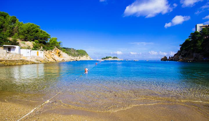 Photo of Ibiza Port de San Miquel San Miguel beach with turquoise water.
