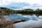 Panoramic view of the lake in the nature reserve Haff Reimech and ornithology center Biodiversum in Remerschen near Schengen, Luxembourg. Nature and bird protection concept.