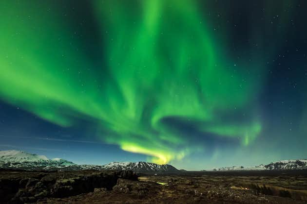 photo of aurora borealis over the thingvellir national park - Iceland.