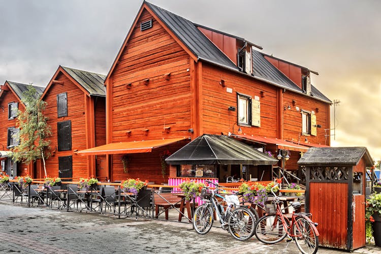 Photo of old wooden houses in the old center around the harbor of Oulu.