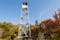 photo of Mt Arab fire tower in Adirondacks surrounded by fall foliage .